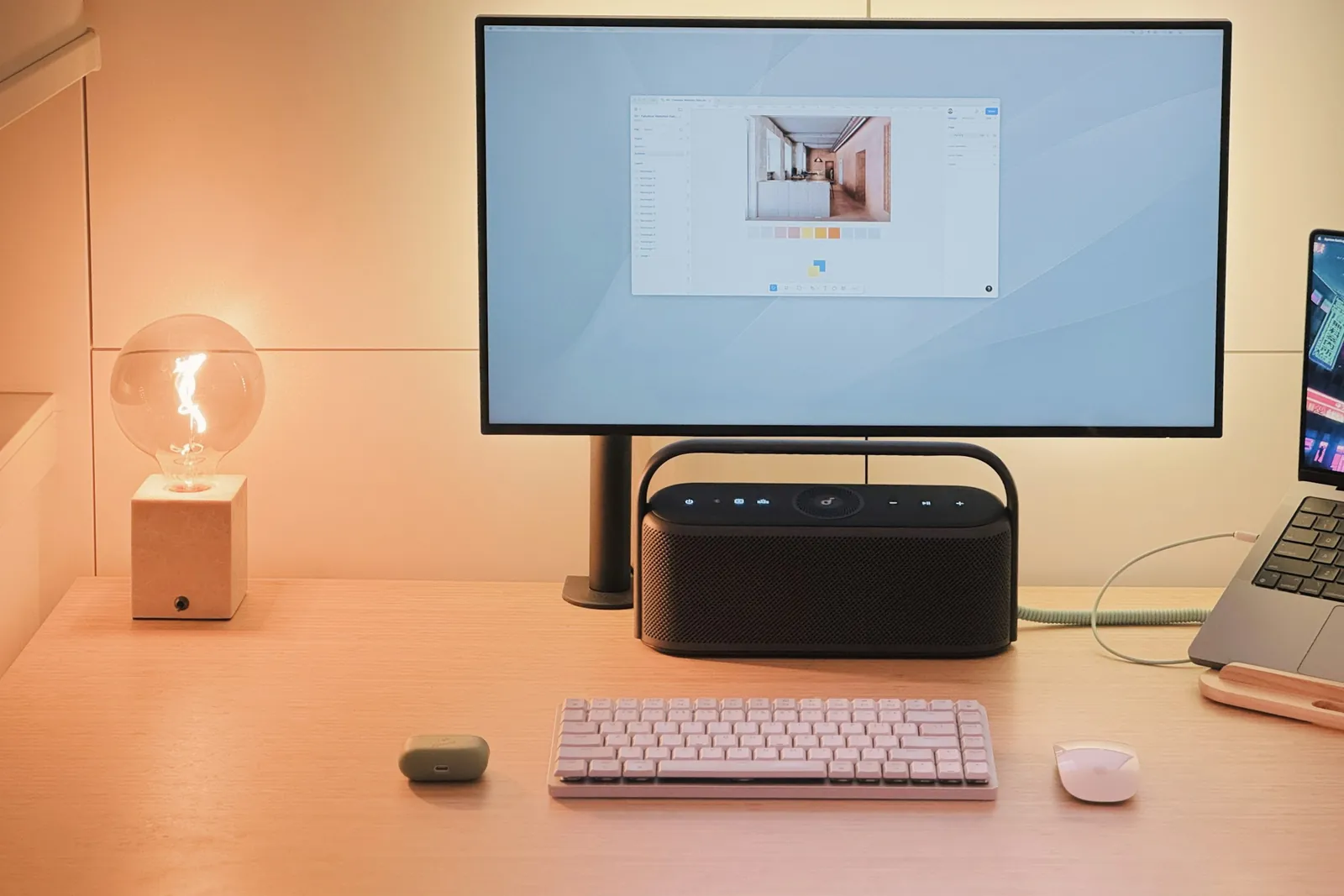 A desk setup with a laptop and monitor
